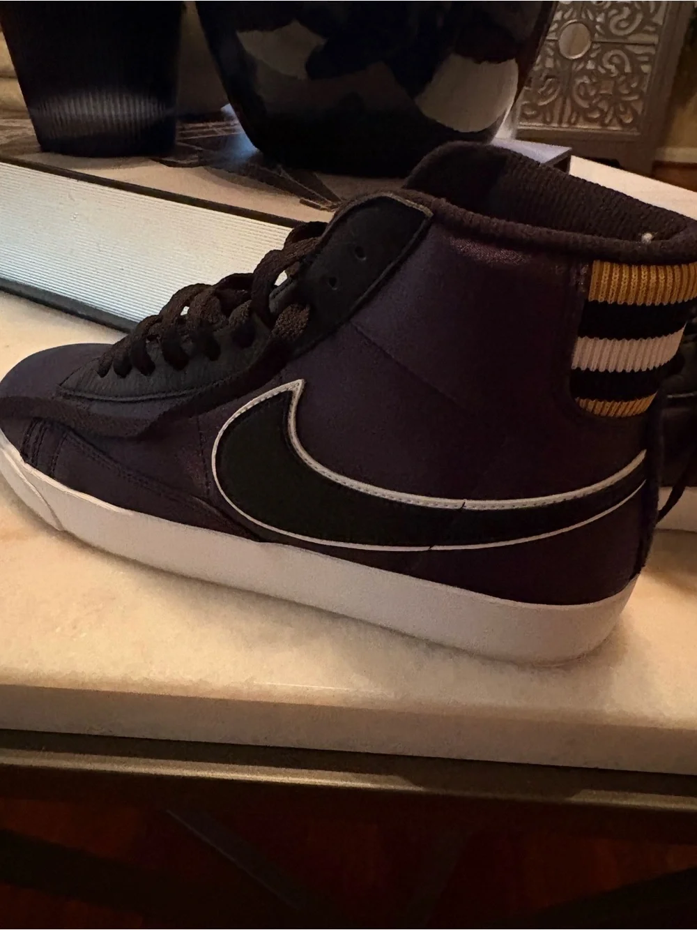 Nike Women's Blaze Black and White Mid-Top Sneaker with Gold Accents